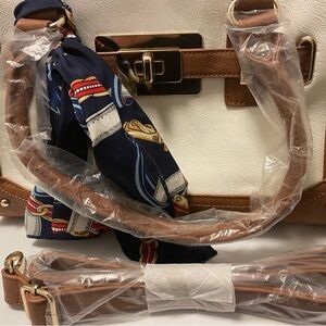 Leather small duffle bag with long strap. New never used